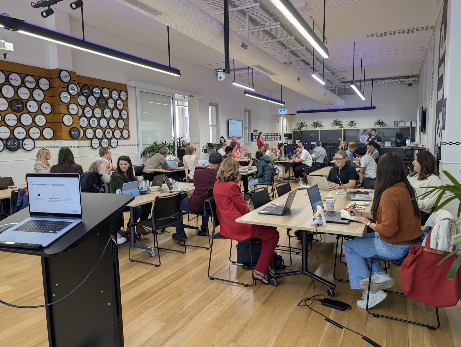 A room of attendees working on their own laptops at an AI Untwisted workshop at Stone and Chalk in Adelaide.