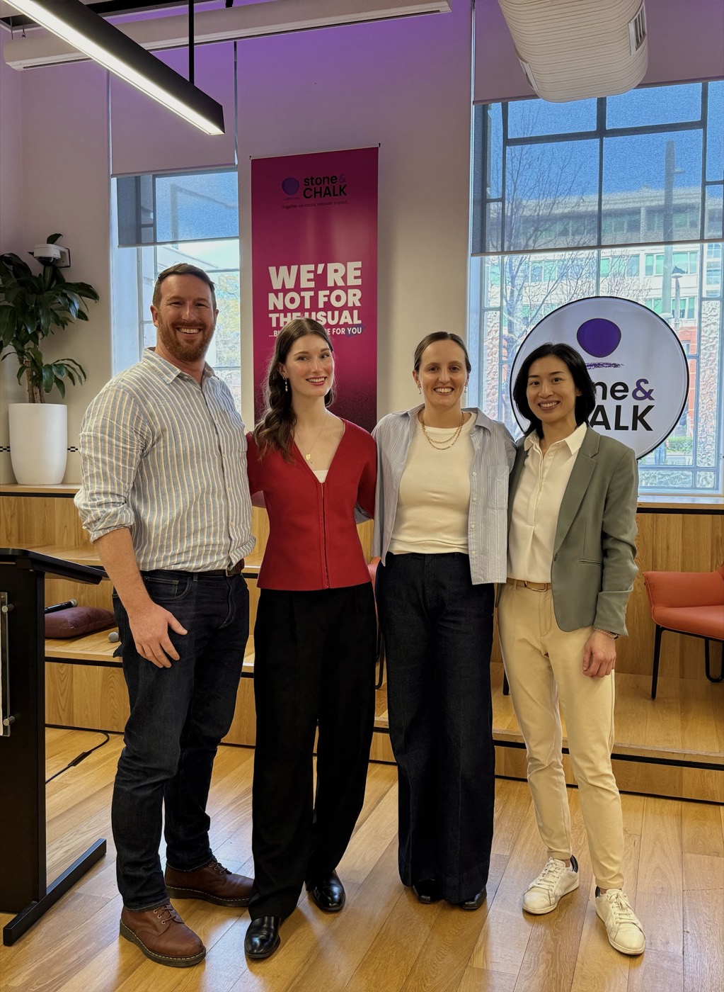 Jess Tresidder with Jack, Ashleigh and Yolanda in front of a Stone and Chalk banner.